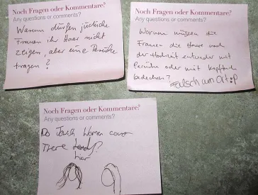 Pink post-it papers with questions regarding Jewish women covering their hair.