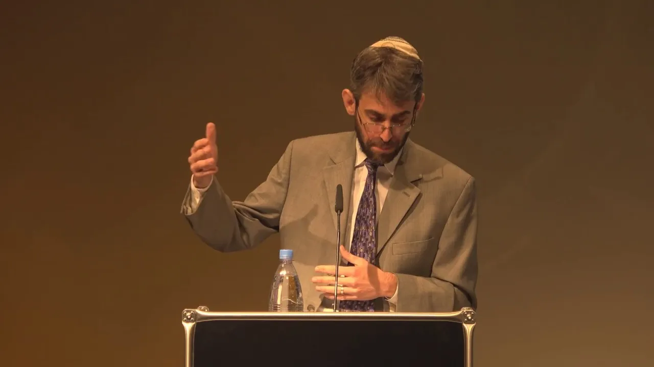 Geoffrey A. Mitelman stands at the lectern